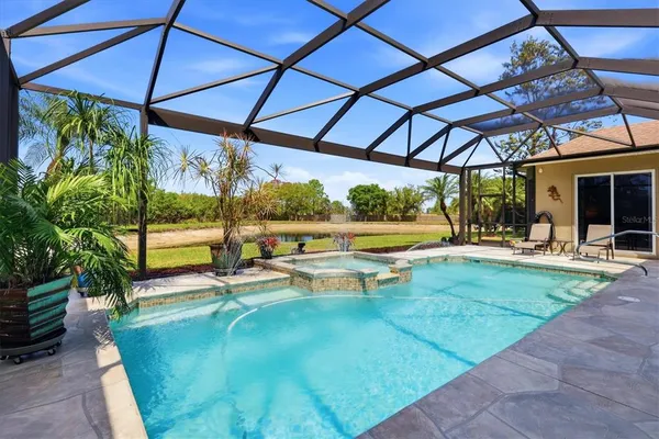 a view of a swimming pool with a patio