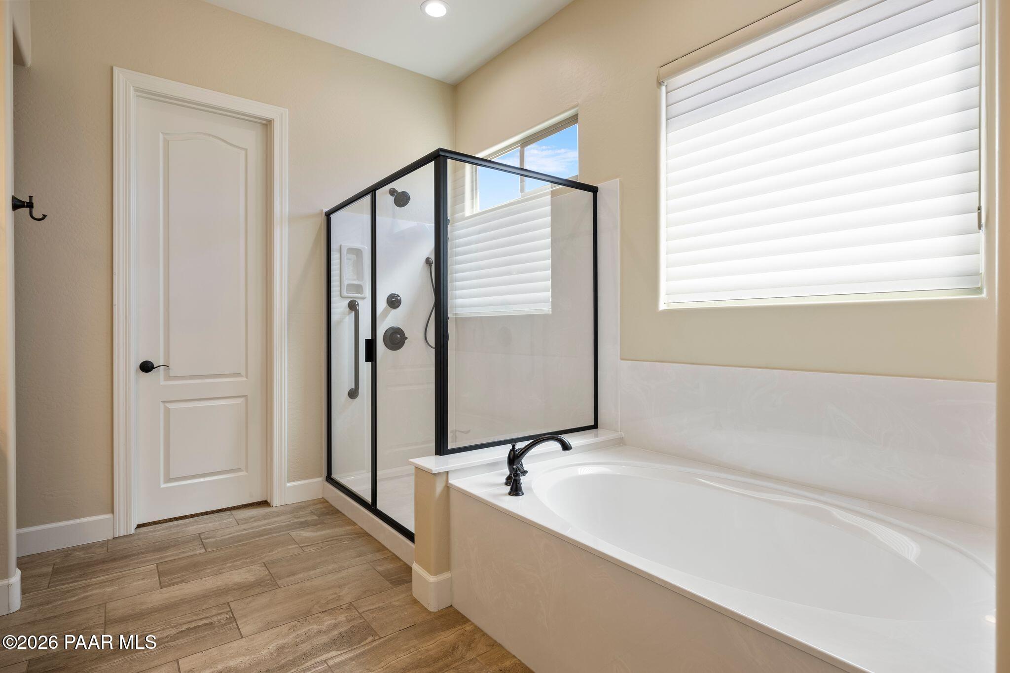 4850 West Three Forks Road Prescott, AZ 86305 - Photo 28 of 69 a bathroom with a bathtub and a shower