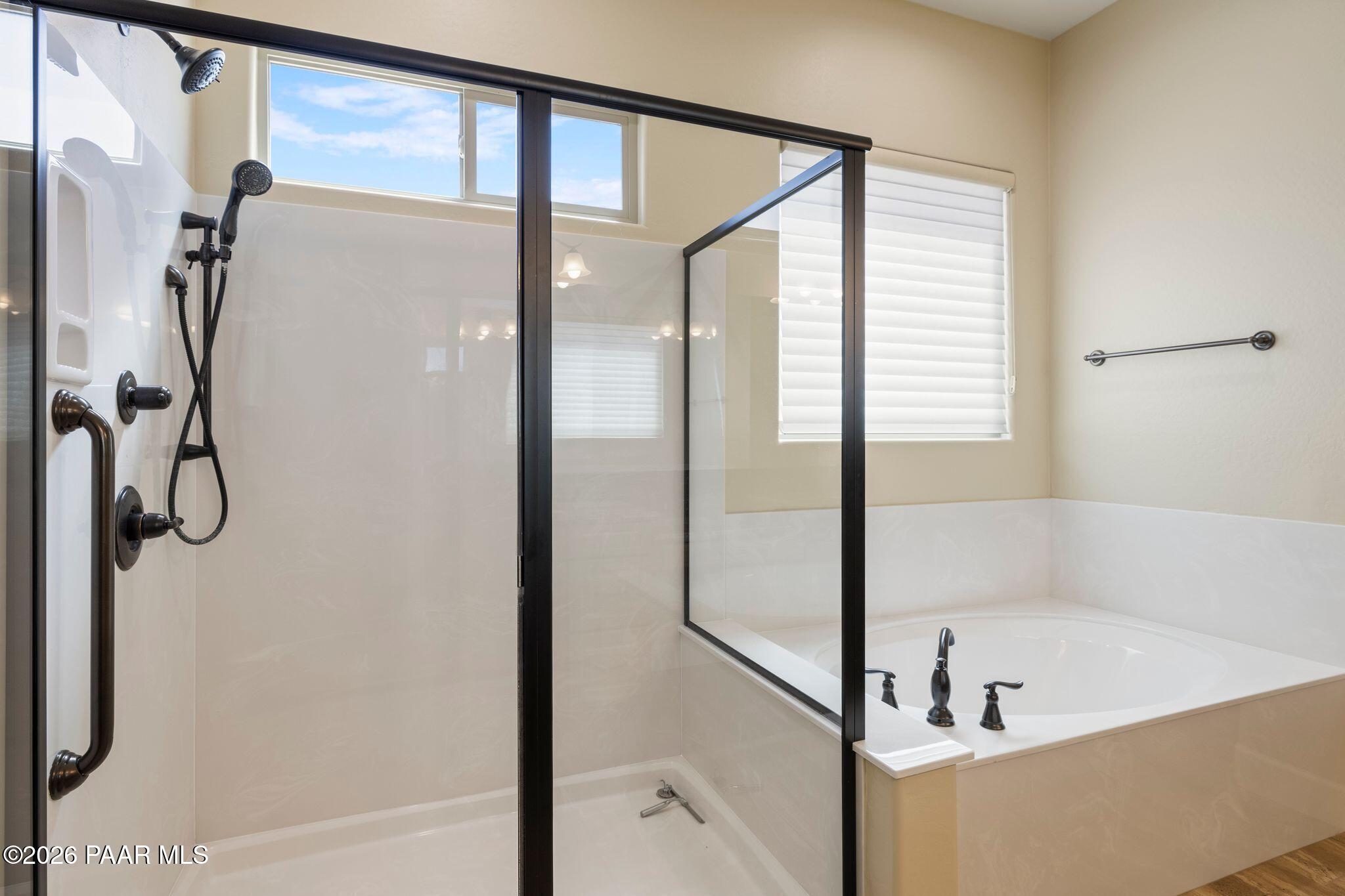 4850 West Three Forks Road Prescott, AZ 86305 - Photo 29 of 69 a bathroom with a bathtub and a shower
