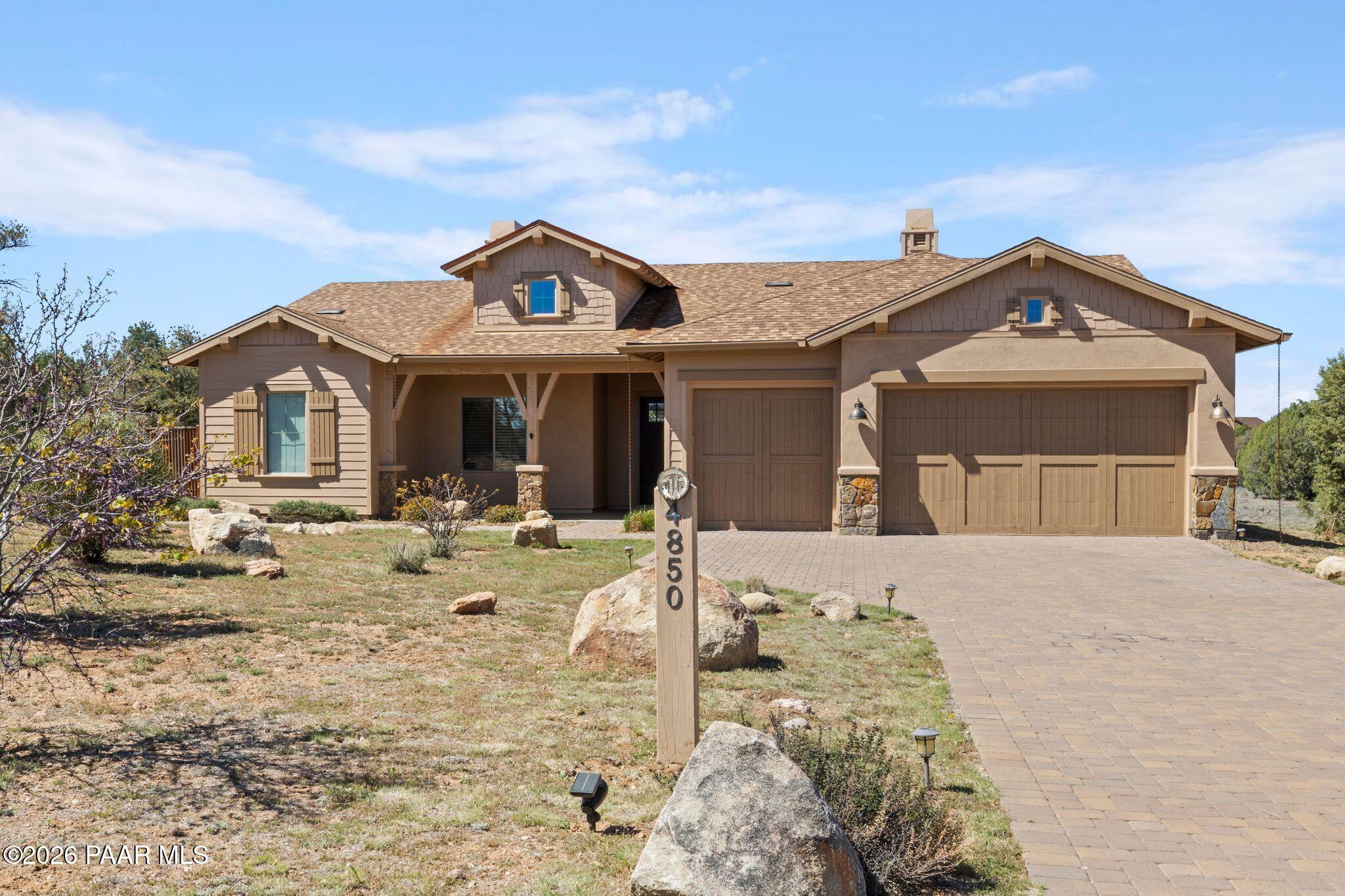 4850 West Three Forks Road Prescott, AZ 86305 - Photo 3 of 69 a front view of a house with garden