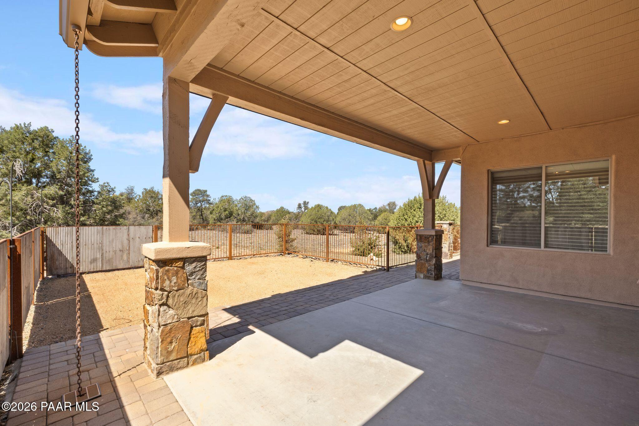 4850 West Three Forks Road Prescott, AZ 86305 - Photo 42 of 69 a view of a patio with a table and chairs