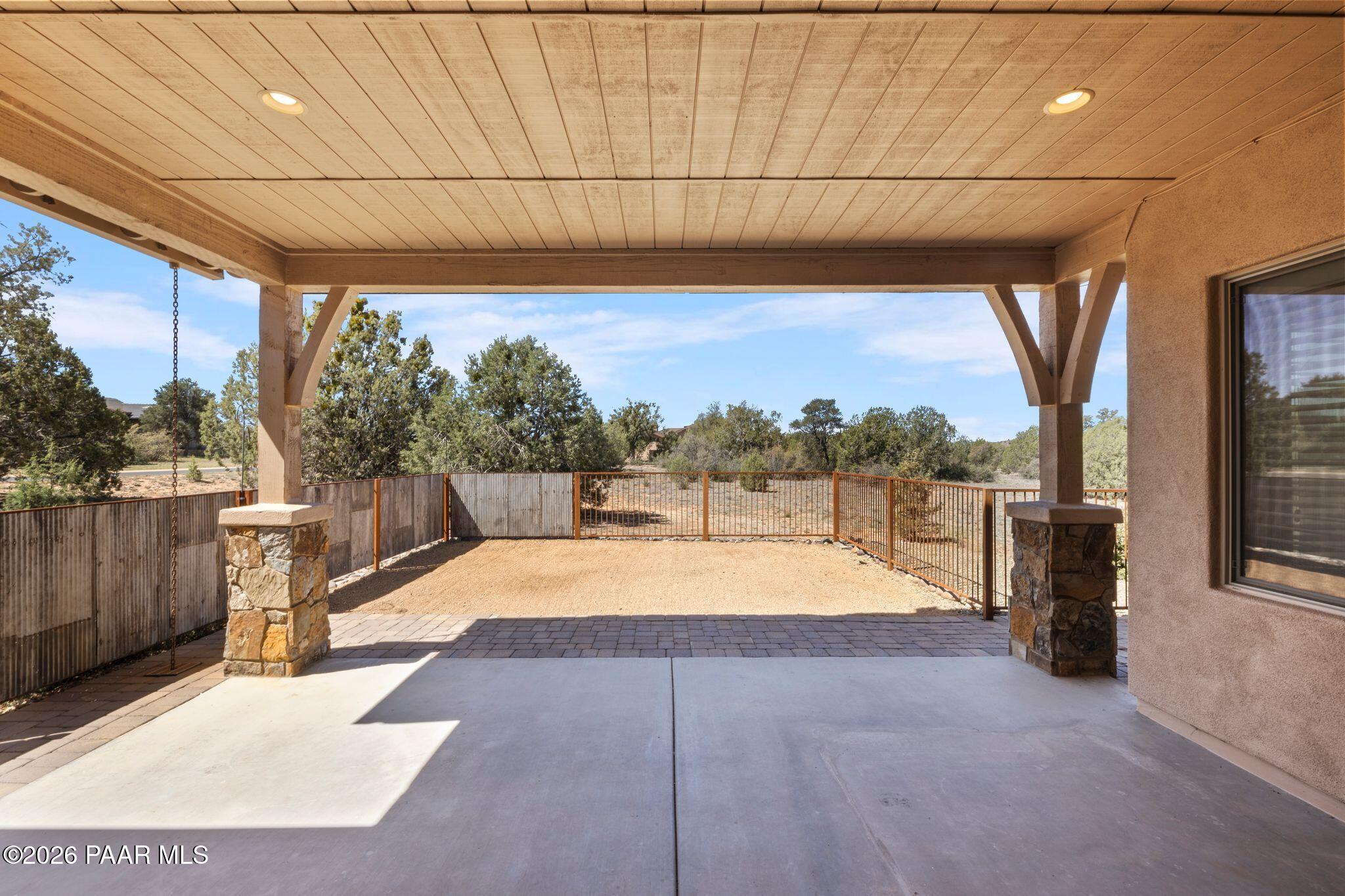 4850 West Three Forks Road Prescott, AZ 86305 - Photo 43 of 69 a view of a patio with a table and chairs under an umbrella