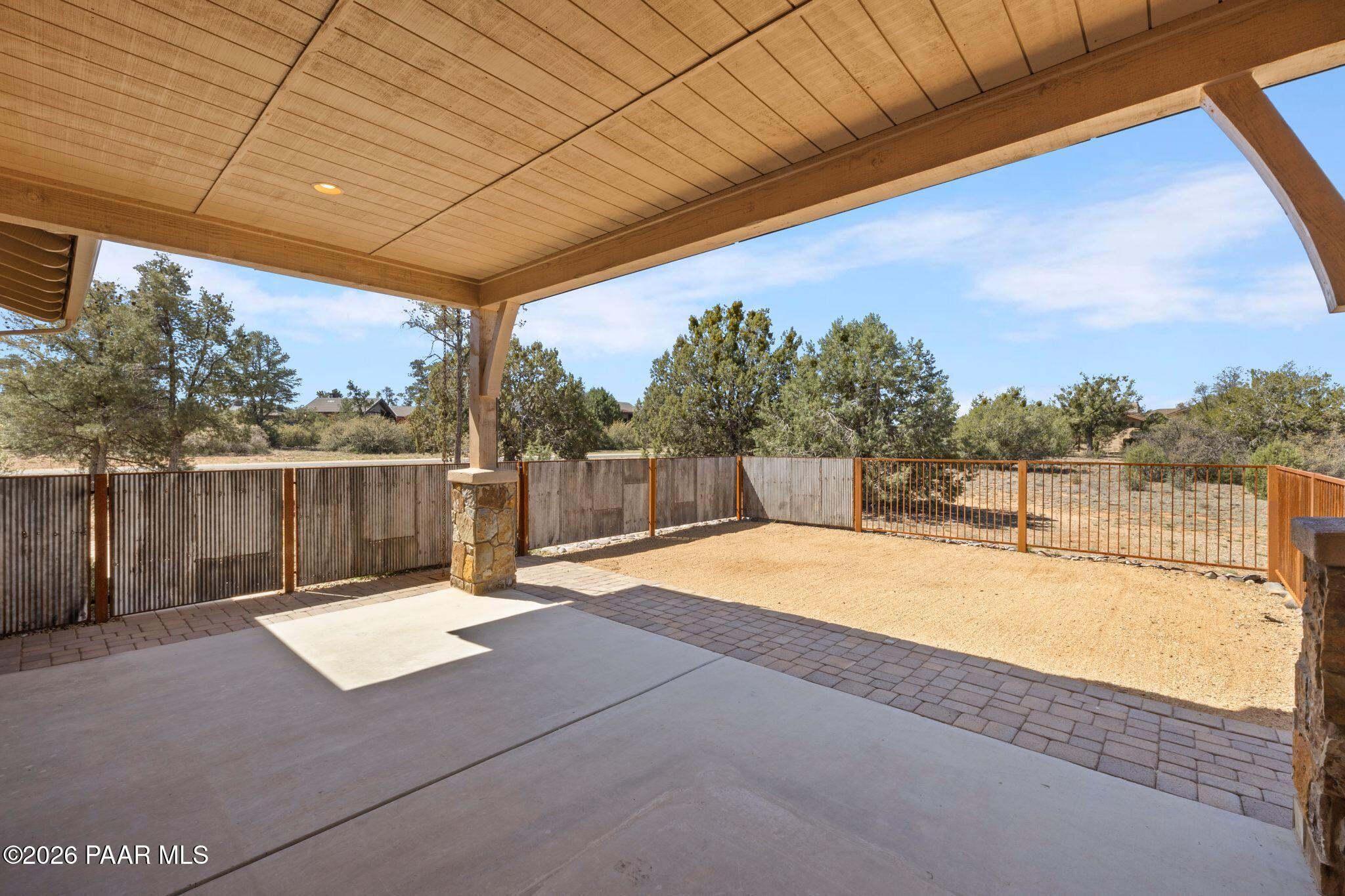 4850 West Three Forks Road Prescott, AZ 86305 - Photo 44 of 69 a backyard of a house with a table and chairs