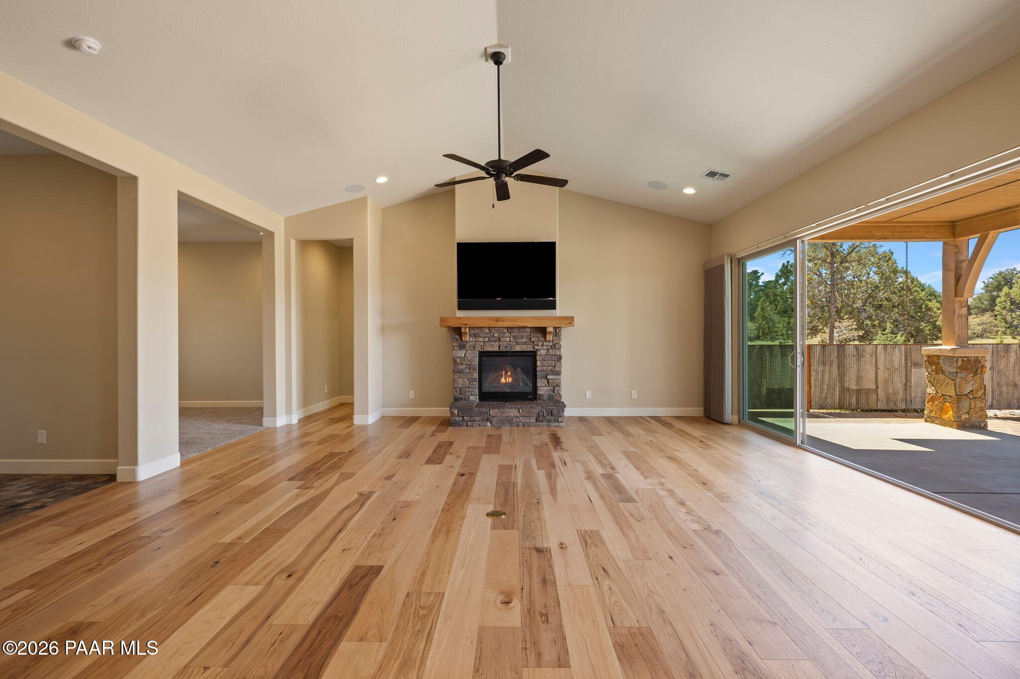 4850 West Three Forks Road Prescott, AZ 86305 - Photo 6 of 69 a view of empty room with wooden floor and fan