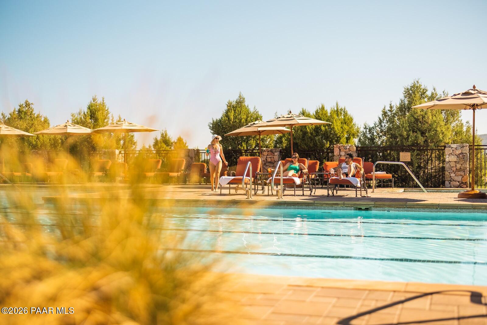 4850 West Three Forks Road Prescott, AZ 86305 - Photo 68 of 69 a view of a swimming pool with an outdoor seating