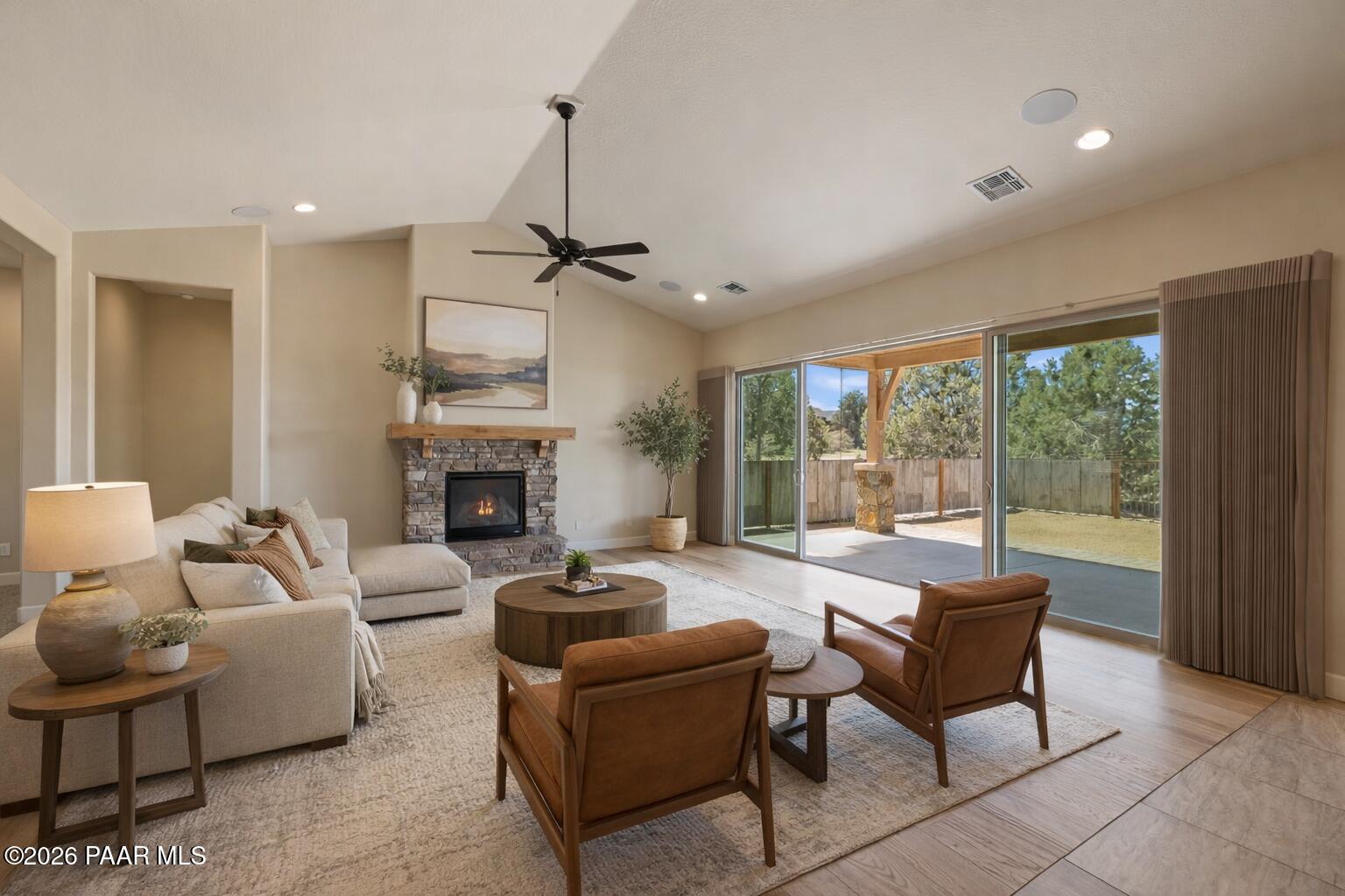 4850 West Three Forks Road Prescott, AZ 86305 - Photo 9 of 69 a living room with furniture and a fireplace