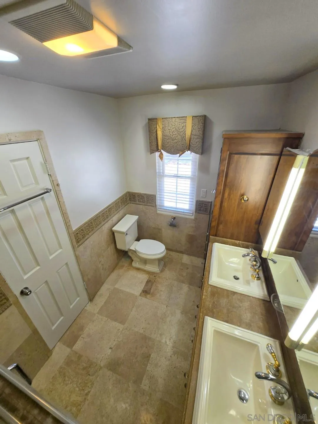 68 Bonita Road Chula Vista, CA 91910 - Photo 11 of 57 a living room with furniture and a flat screen tv