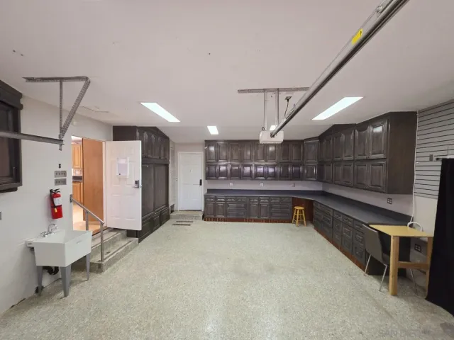 a view of an empty room with a fireplace