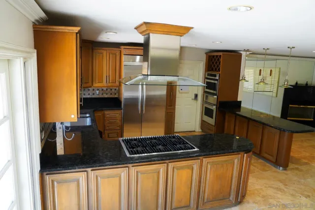 a view of a livingroom with an empty space and a window