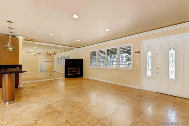 a view of kitchen and hall with wooden floor