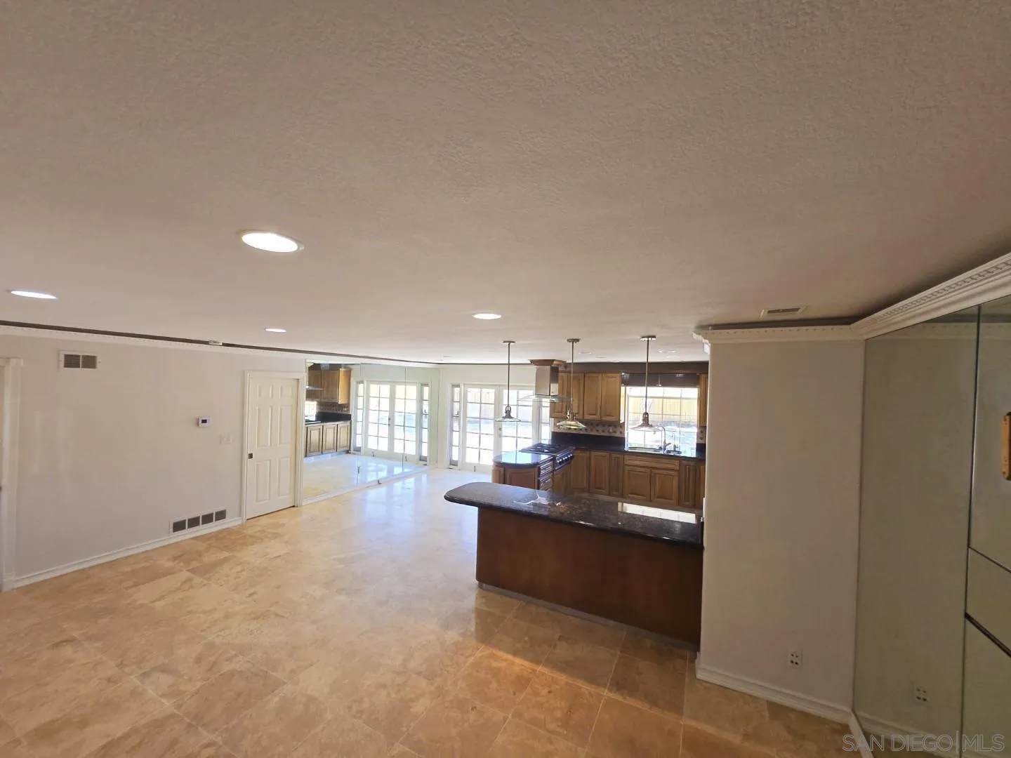 68 Bonita Road Chula Vista, CA 91910 - Photo 33 of 57 a kitchen with granite countertop a refrigerator and a sink