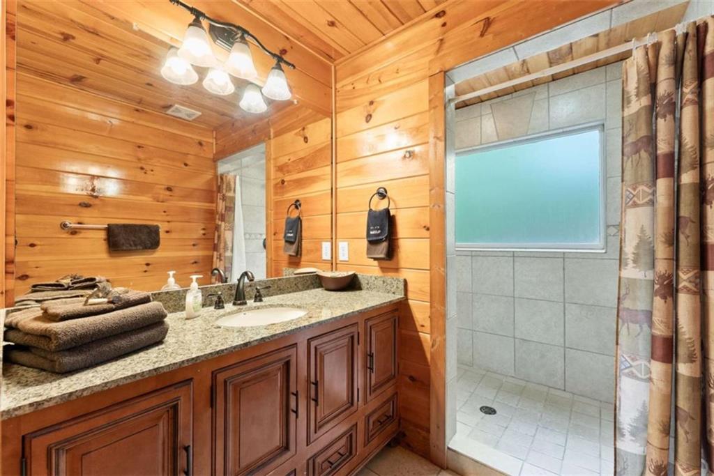 53 Elm Ridge Drive Cleveland, GA 30528 - Photo 25 of 60 a bathroom with a sink double vanity and shower