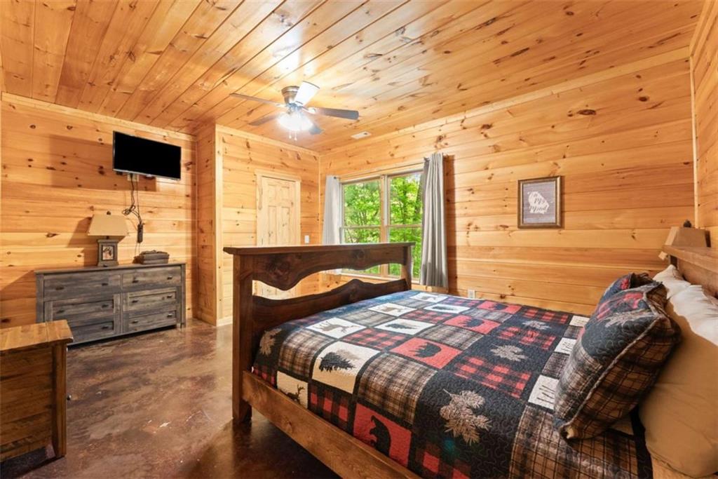 53 Elm Ridge Drive Cleveland, GA 30528 - Photo 36 of 60 a bedroom with a bed and wooden floor