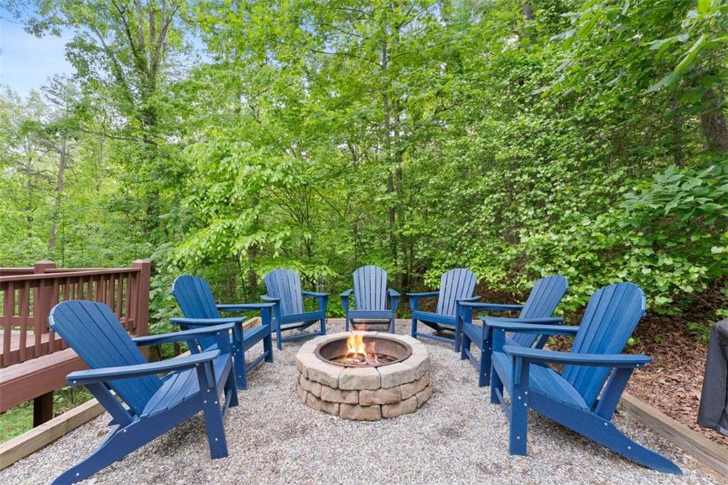 53 Elm Ridge Drive Cleveland, GA 30528 - Photo 47 of 60 a backyard of a house with outdoor seating