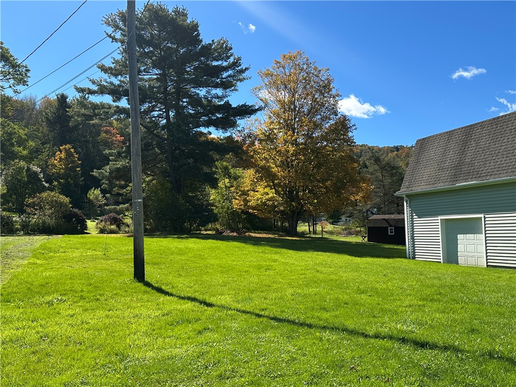 A spacious green lawn stretches alongside a classi