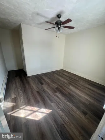 a bathroom with a bathtub sink and mirror