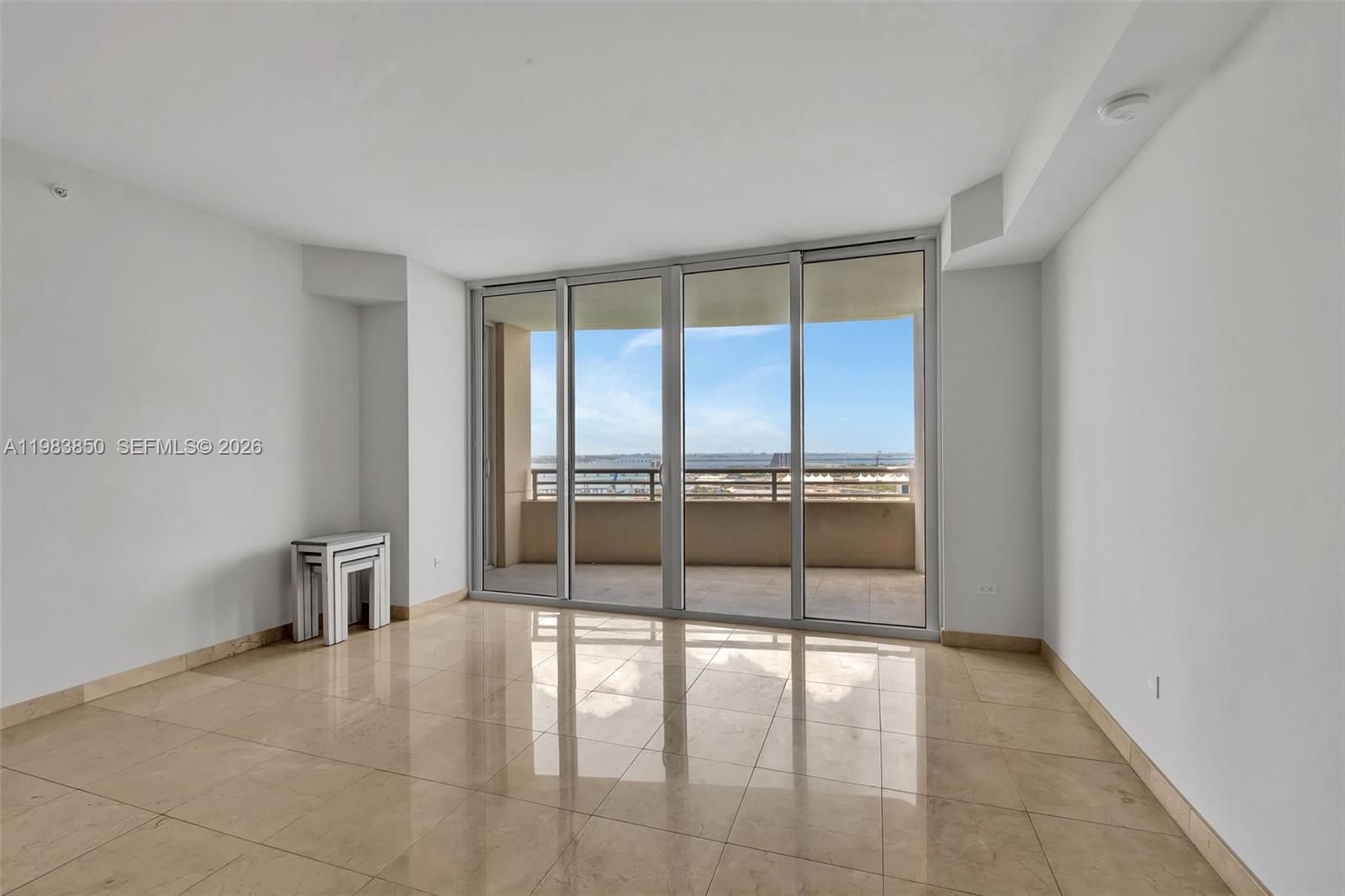 848 Brickell Key Drive, Unit 2602 Miami, FL 33131 - Photo 12 of 40 a view of an empty room with a window