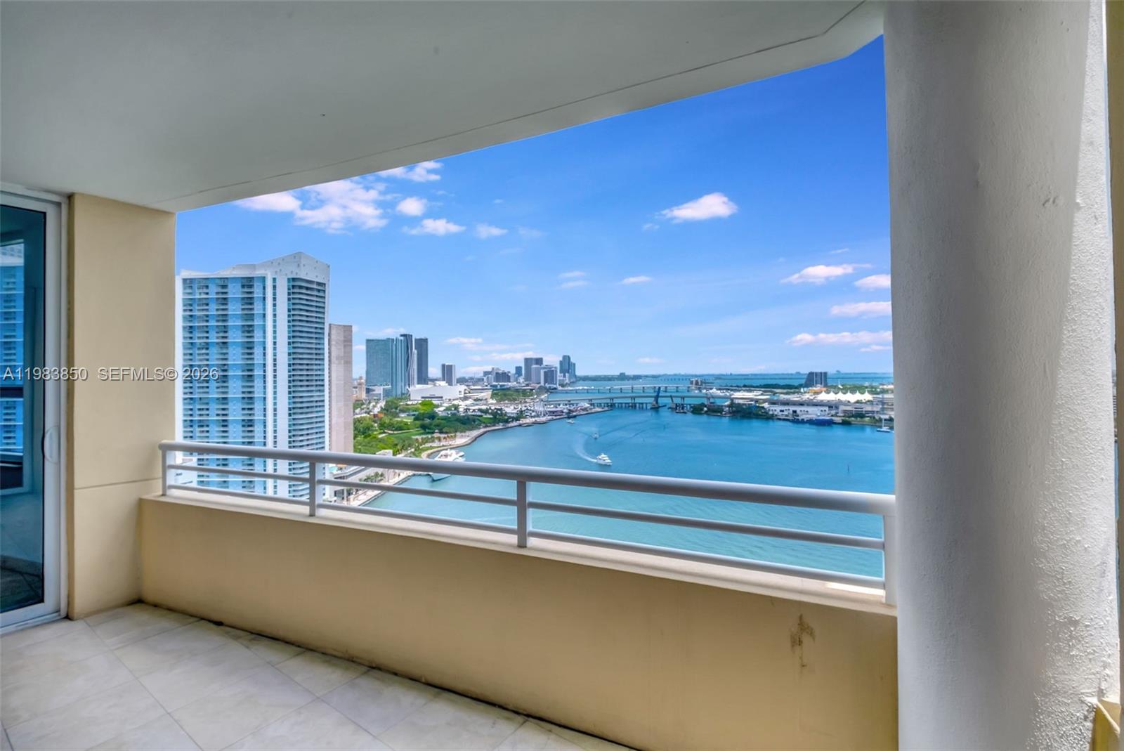 848 Brickell Key Drive, Unit 2602 Miami, FL 33131 - Photo 34 of 40 a view of a living room with a large window