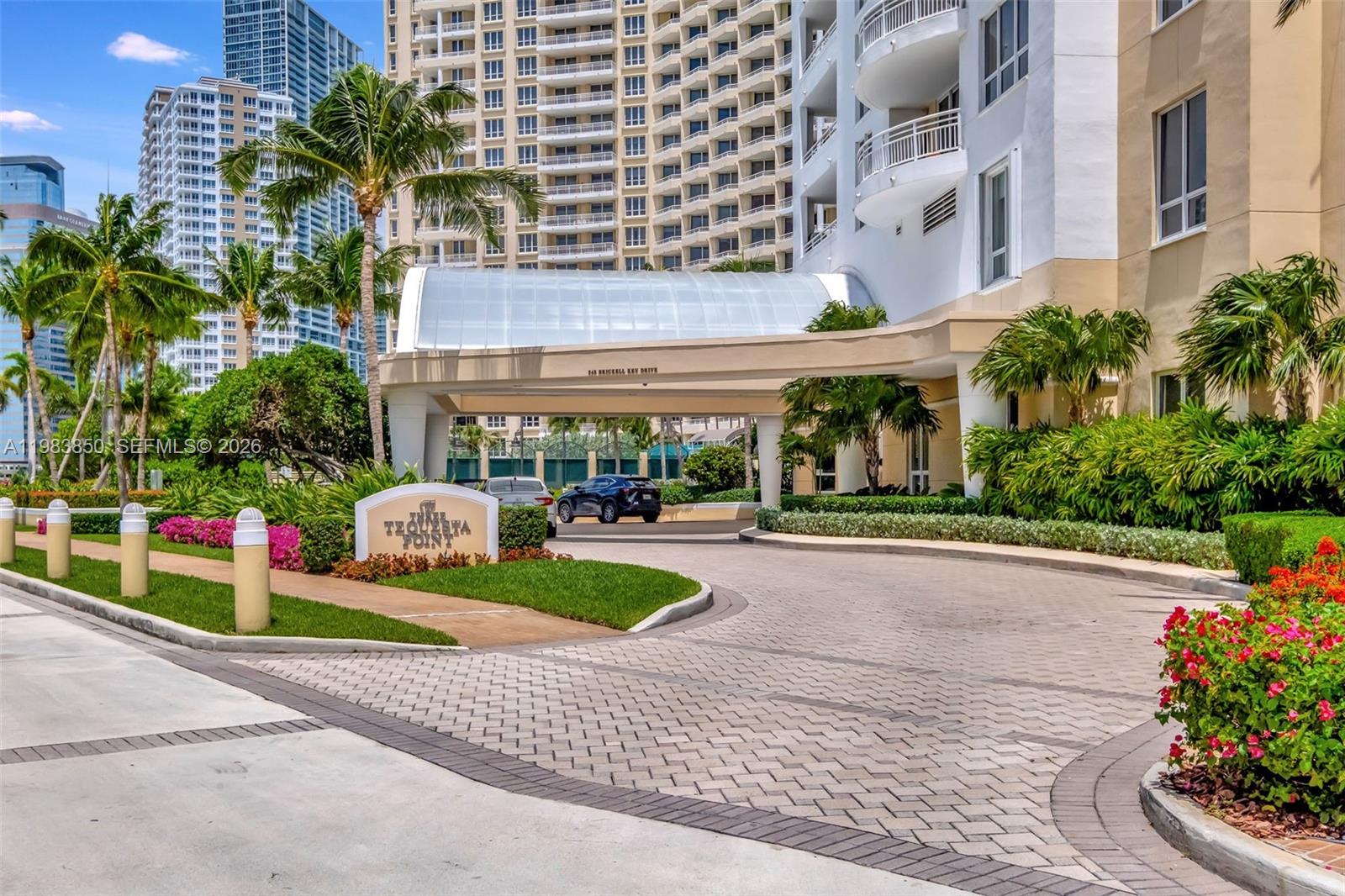 848 Brickell Key Drive, Unit 2602 Miami, FL 33131 - Photo 5 of 40 a front view of building with yard