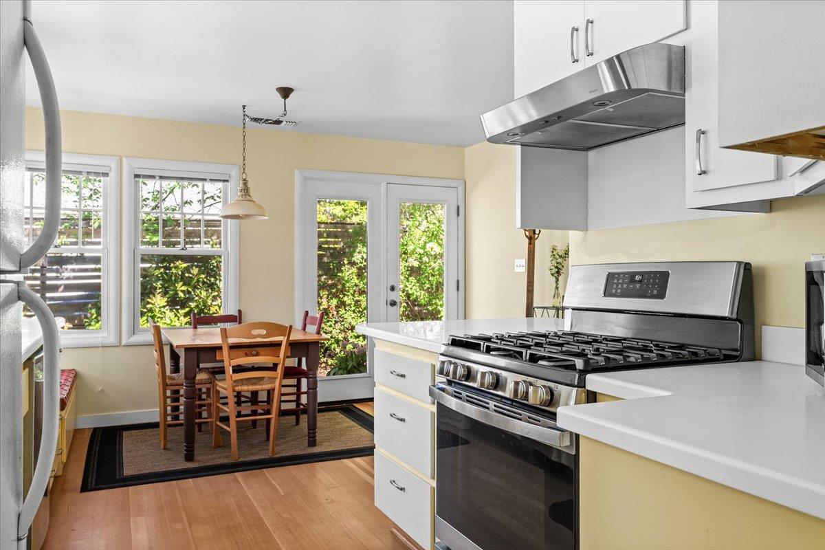 10041 Greenwood Road Grass Valley, CA 95945 - Photo 18 of 65 a kitchen with stainless steel appliances a stove a table and chairs