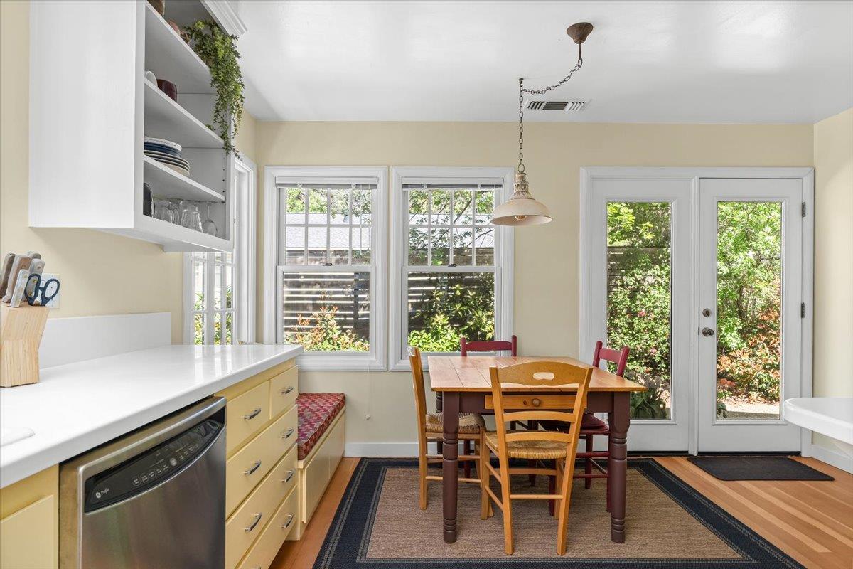 10041 Greenwood Road Grass Valley, CA 95945 - Photo 21 of 65 a dining room with furniture a chandelier and wooden floor