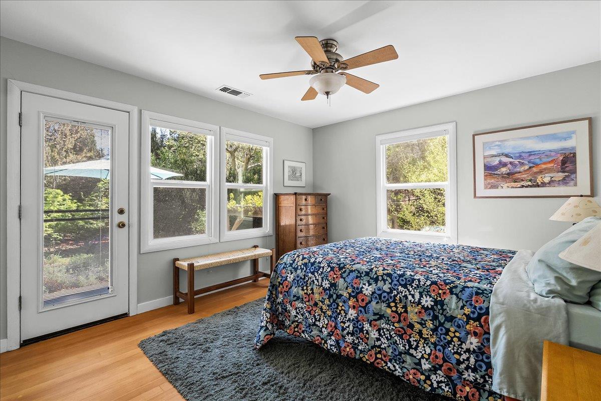 10041 Greenwood Road Grass Valley, CA 95945 - Photo 27 of 65 a bedroom with a bed and a large window