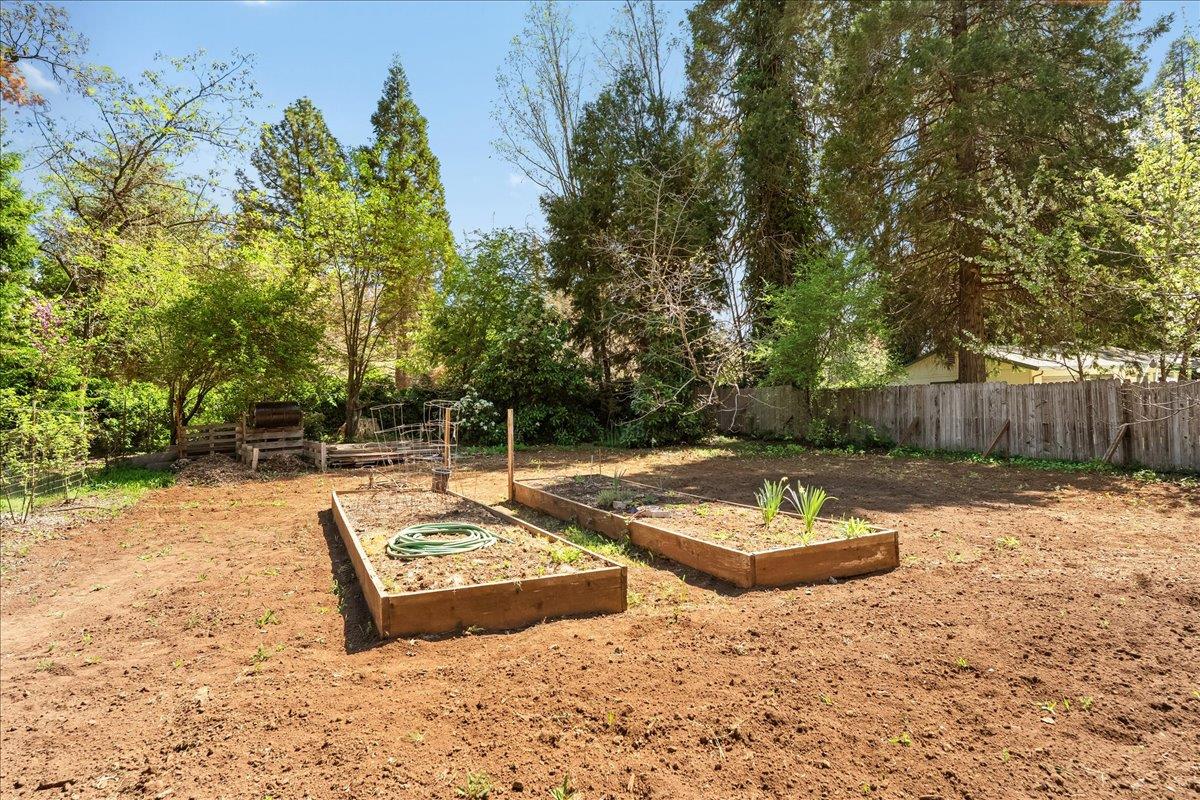 10041 Greenwood Road Grass Valley, CA 95945 - Photo 46 of 65 a view of a backyard with a table and chairs