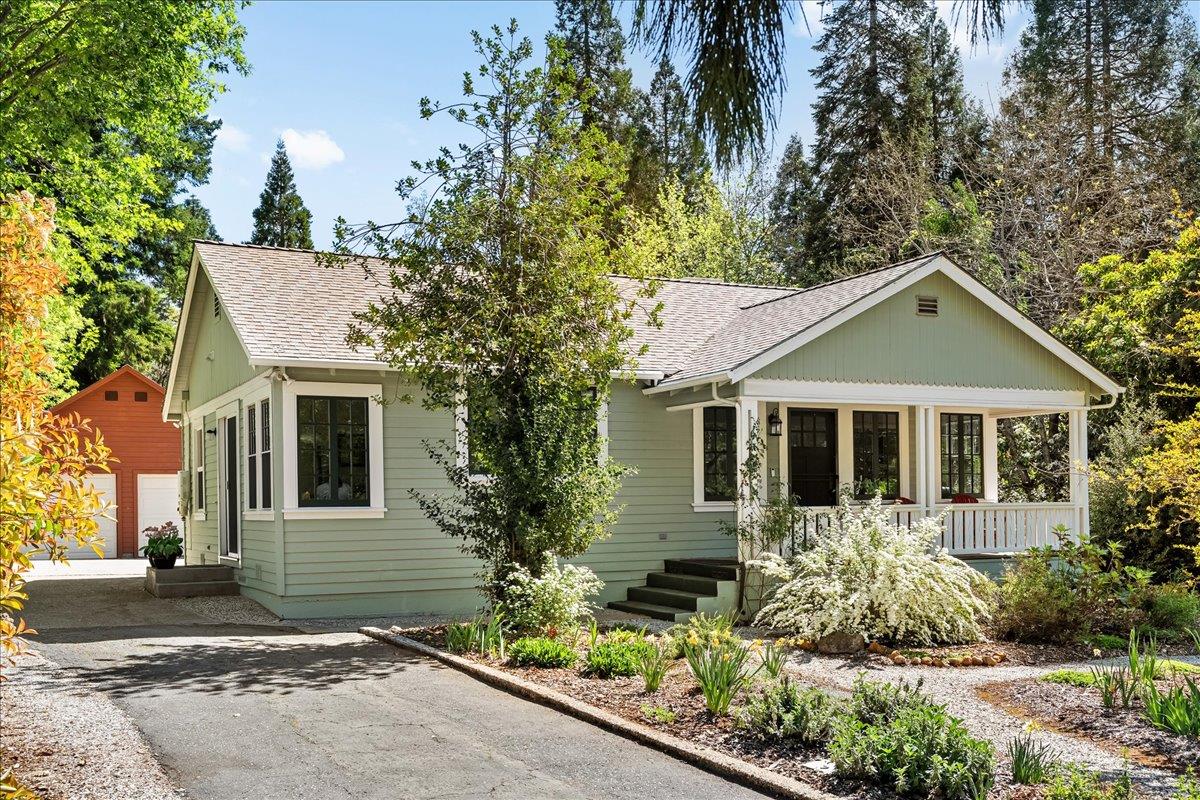 10041 Greenwood Road Grass Valley, CA 95945 - Photo 59 of 65 a front view of a house with a yard and potted plants
