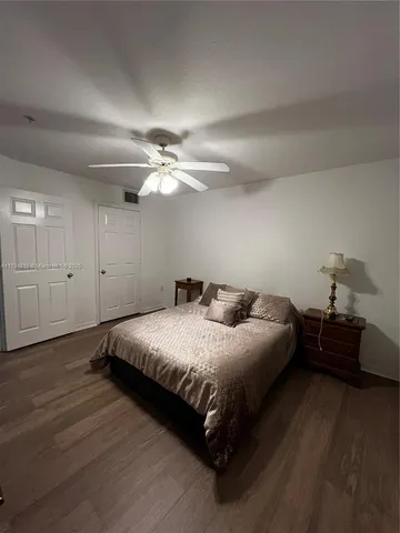 a bedroom with a bed and closet