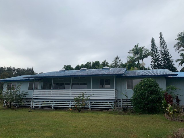 41-1514 Homestead Road Ookala, HI 96774 - Photo 3 of 30 a front view of a house with a garden