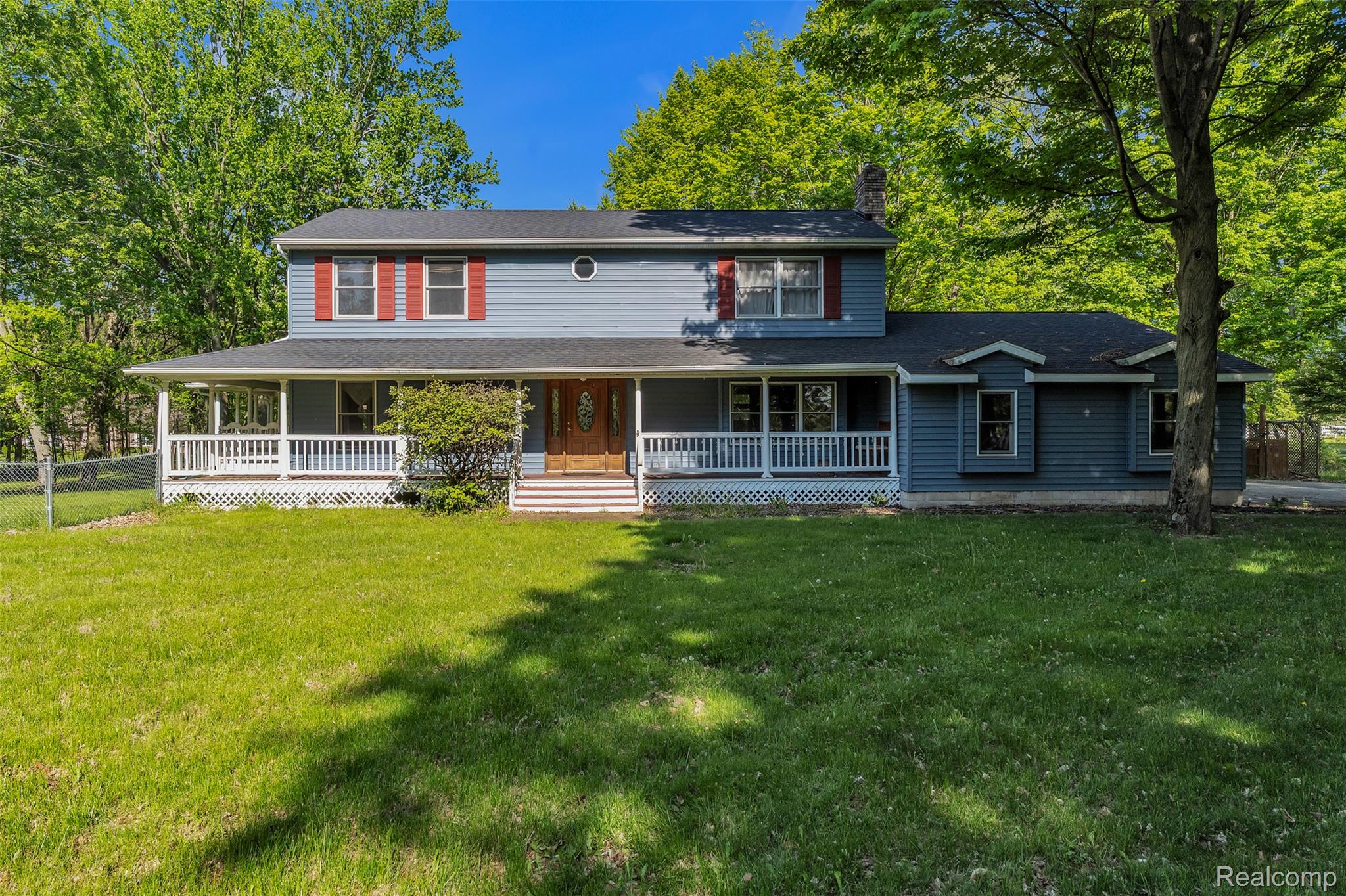 1345 Ives Road Mason, MI 48854 - Photo 91 of 92 Country-style home featuring covered porch, a front lawn, and a chimney