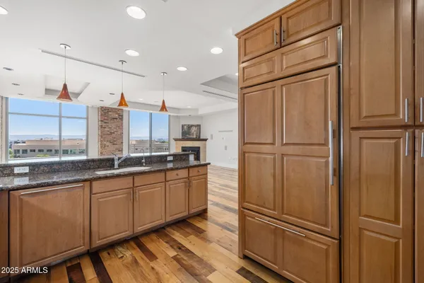 a view of kitchen with cabinets and wooden floor