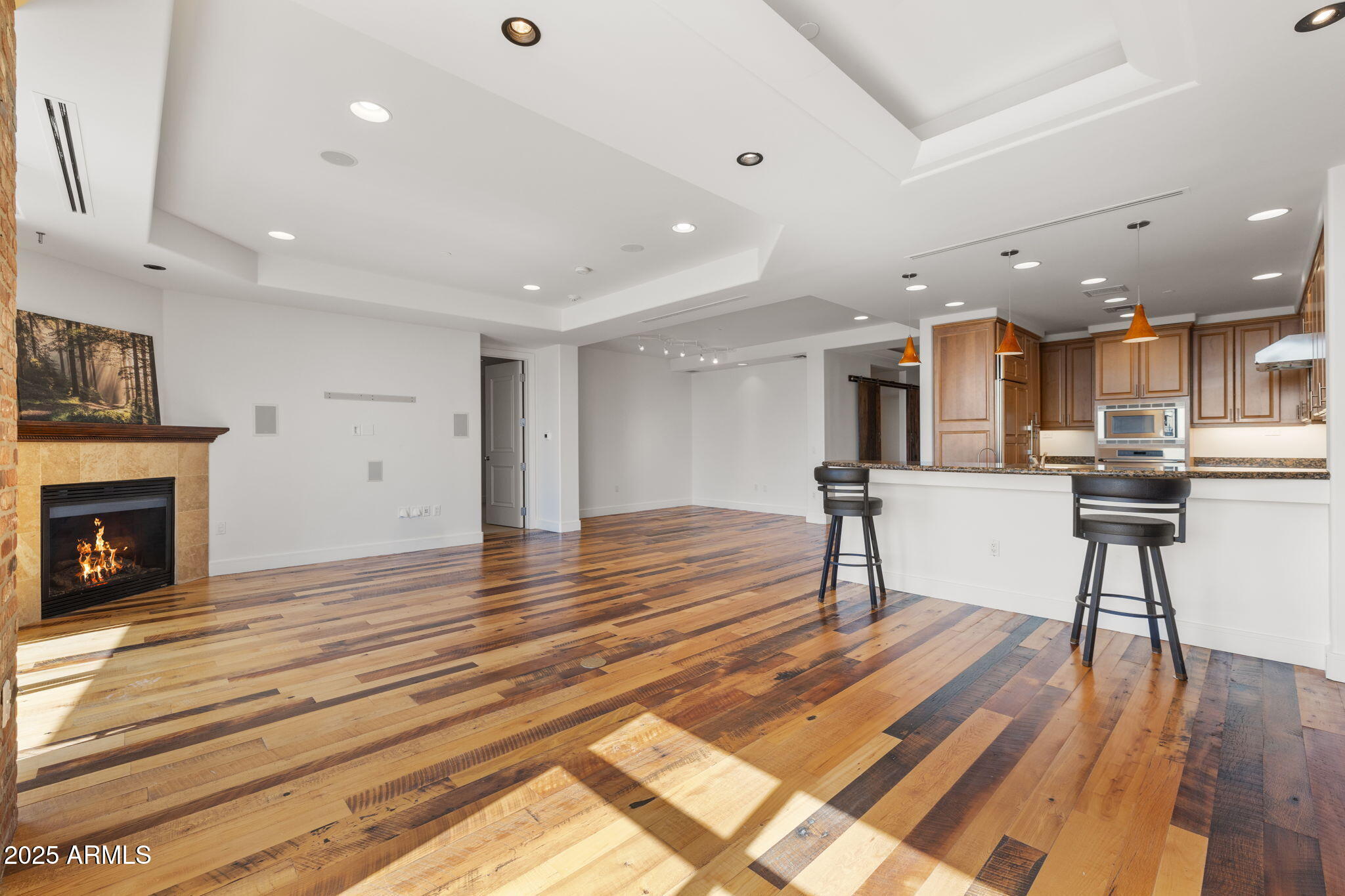 2211 East Camelback Road, Unit 607 Phoenix, AZ 85016 - Photo 14 of 41 a view of kitchen with cabinets and wooden floor