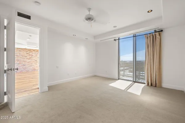 a large bathroom with a sink and a large mirror
