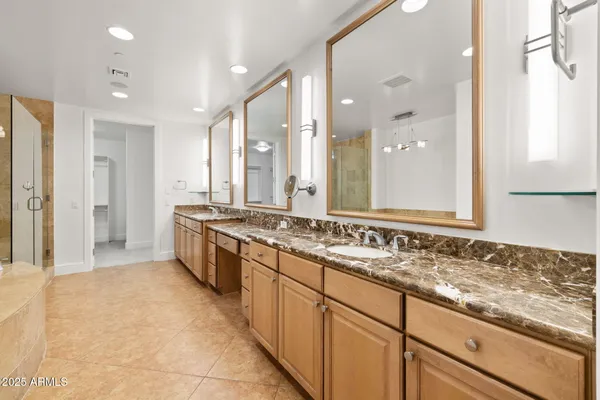 a bathroom with a tub and shower