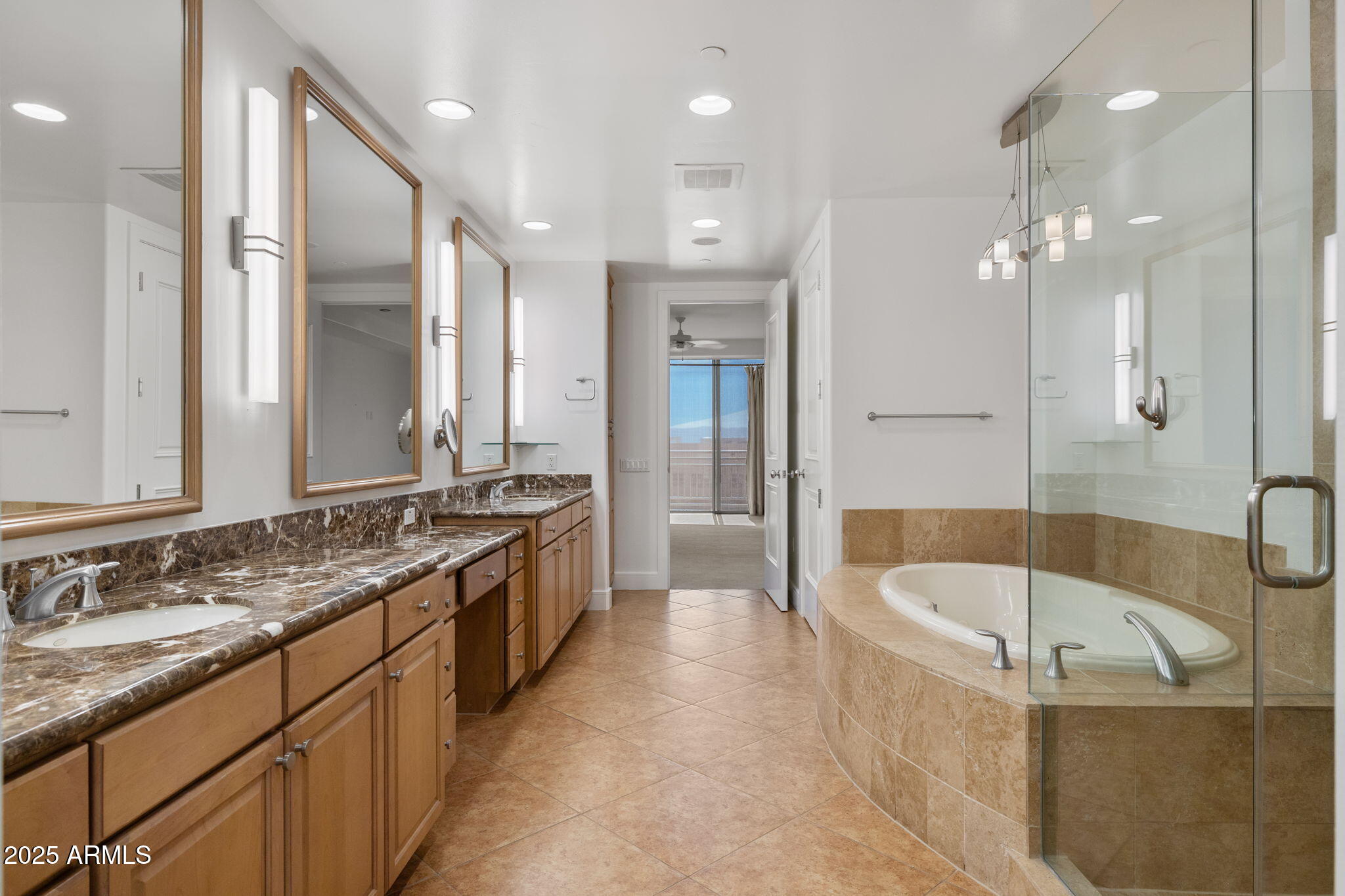 2211 East Camelback Road, Unit 607 Phoenix, AZ 85016 - Photo 21 of 41 a large spacious bathroom with a granite countertop tub sink shower and mirror