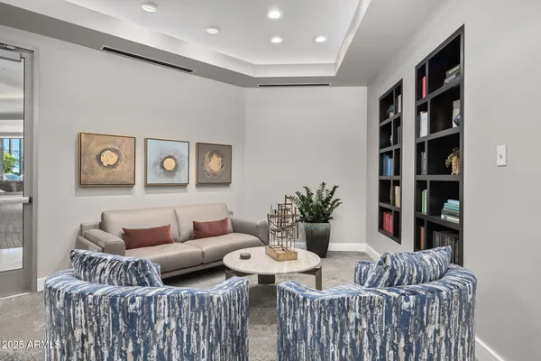 a view of a livingroom with furniture and cabinet