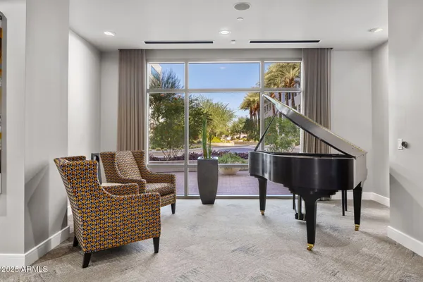 a living room with furniture and a large window