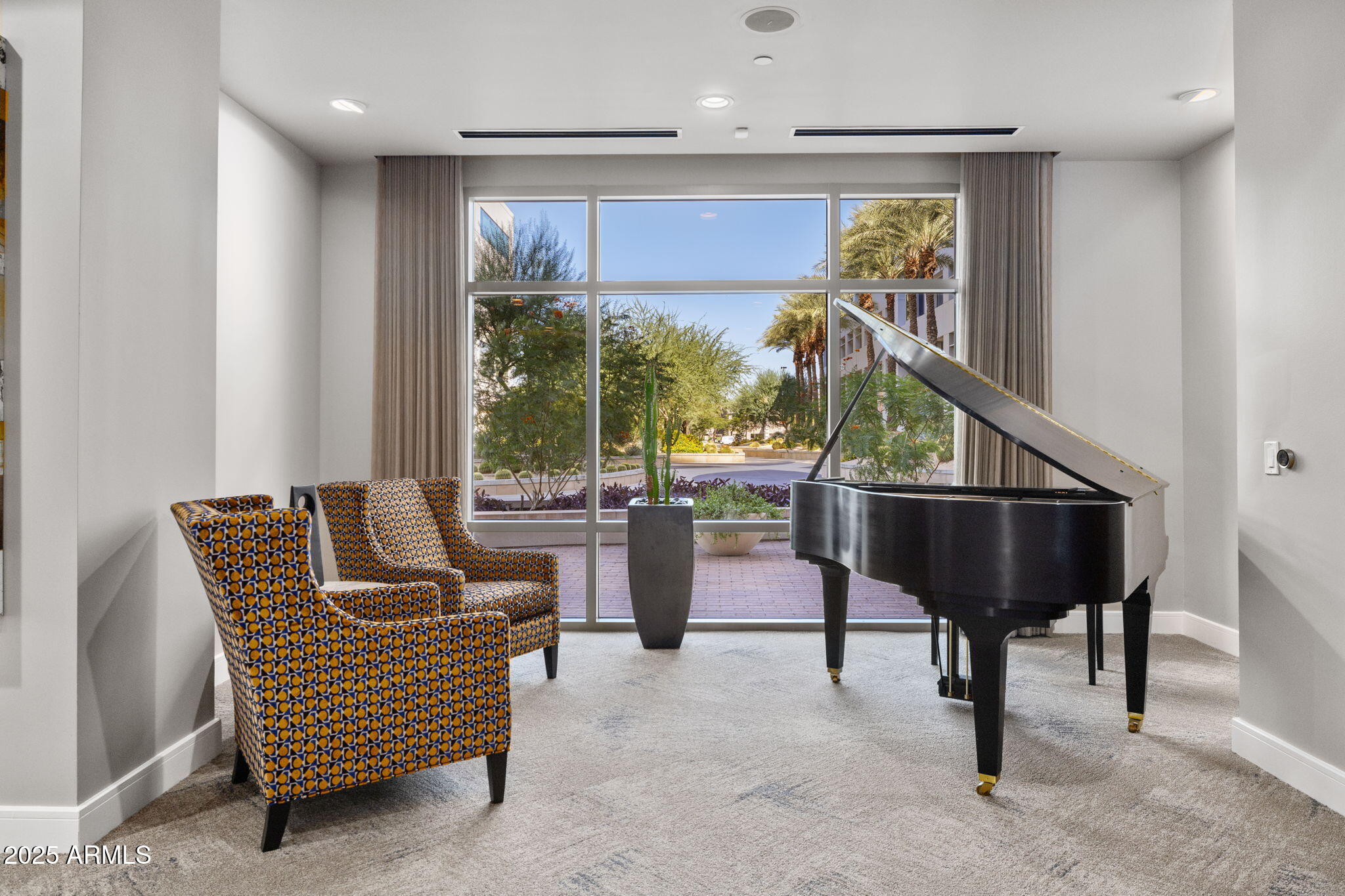 2211 East Camelback Road, Unit 607 Phoenix, AZ 85016 - Photo 31 of 41 a living room with furniture a rug and white walls