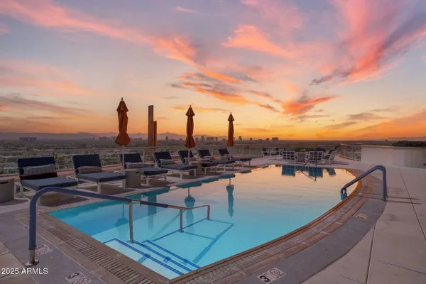 a view of a swimming pool with a lounge chair