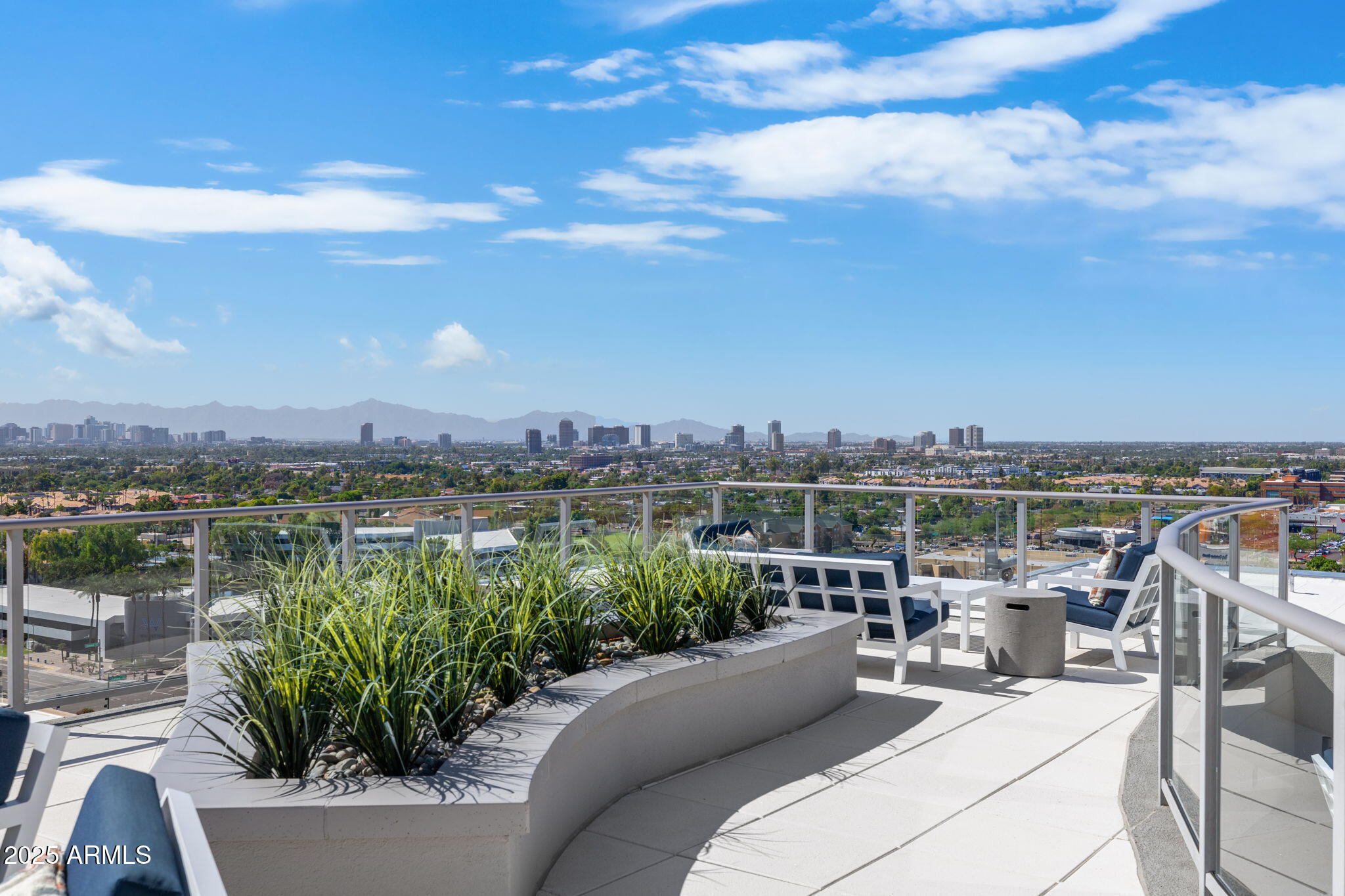 2211 East Camelback Road, Unit 607 Phoenix, AZ 85016 - Photo 36 of 41 a view of a terrace with sitting area