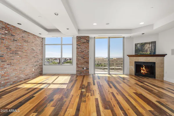 a spacious bedroom with a bed and a fireplace