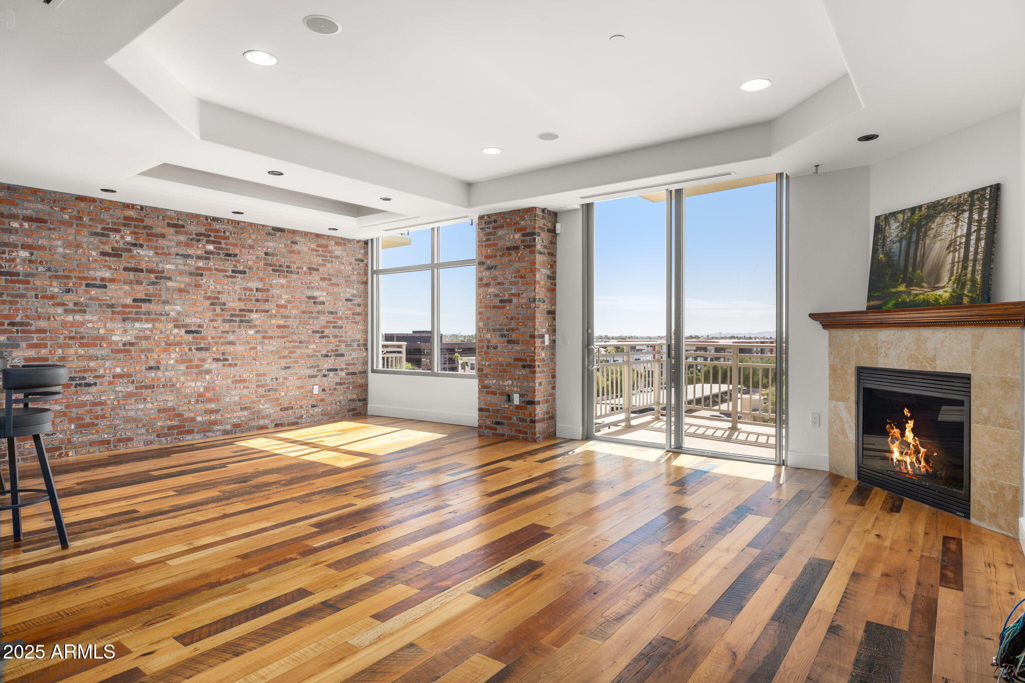 2211 East Camelback Road, Unit 607 Phoenix, AZ 85016 - Photo 6 of 41 a spacious bedroom with a bed and a fireplace