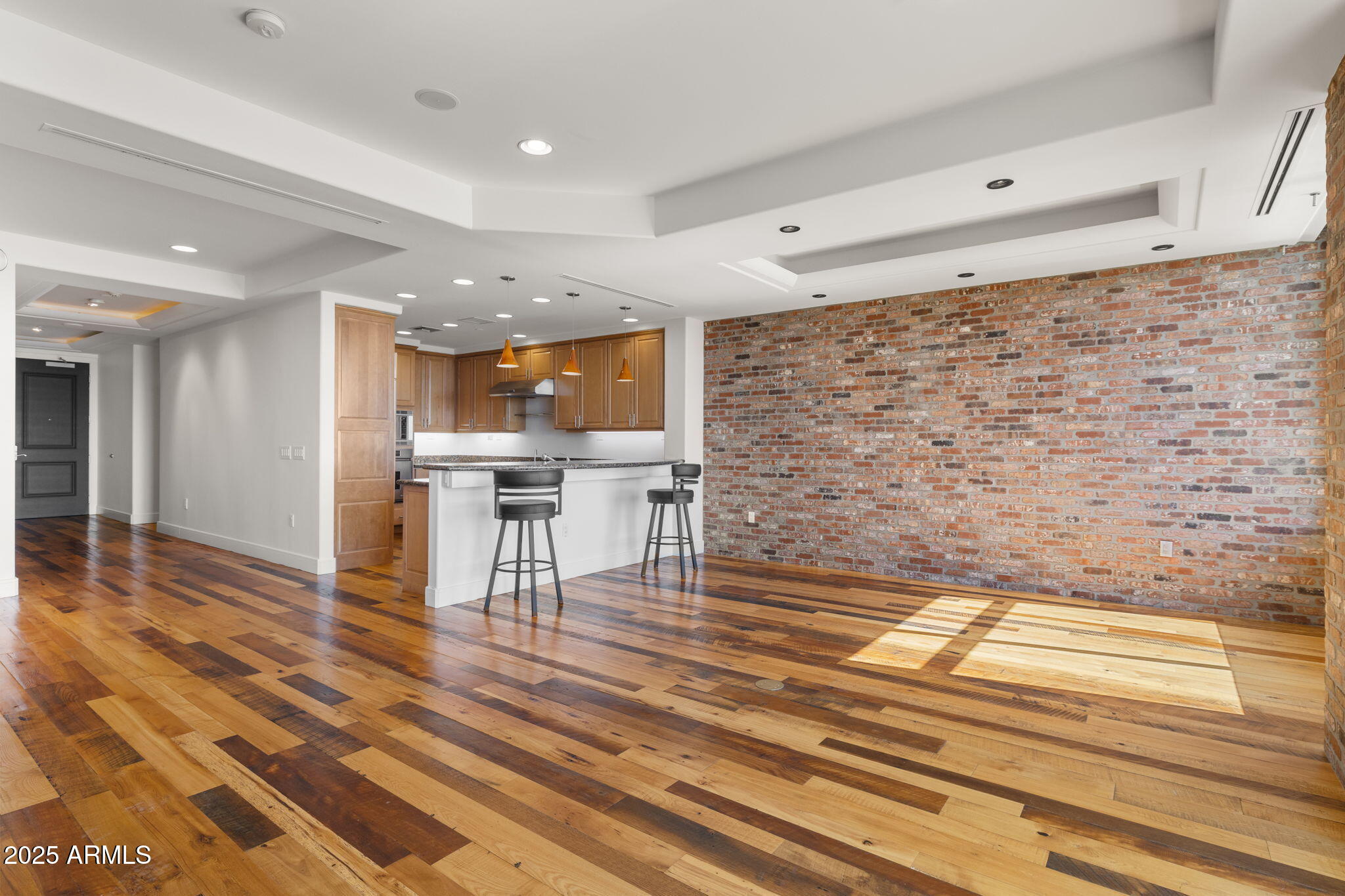 2211 East Camelback Road, Unit 607 Phoenix, AZ 85016 - Photo 8 of 41 a view of kitchen with furniture and wooden floor