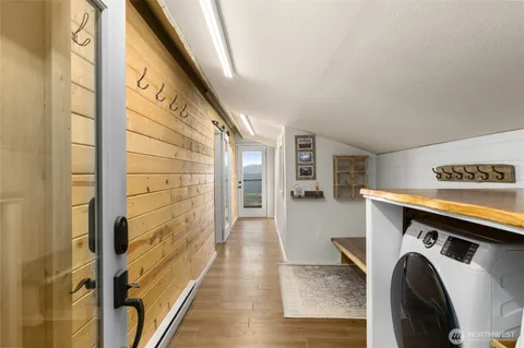 a view of livingroom with washer and dryer