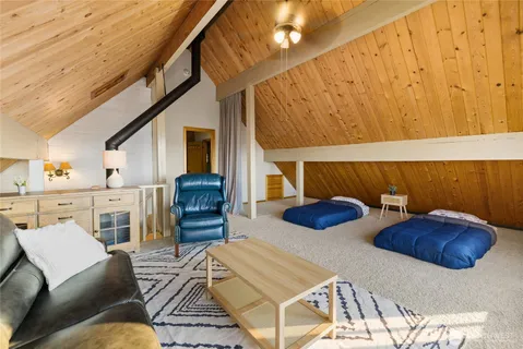 a bedroom with furniture and a lamp