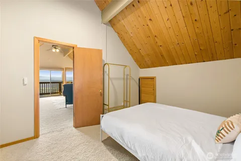 a bedroom with a bed and a view of bathroom