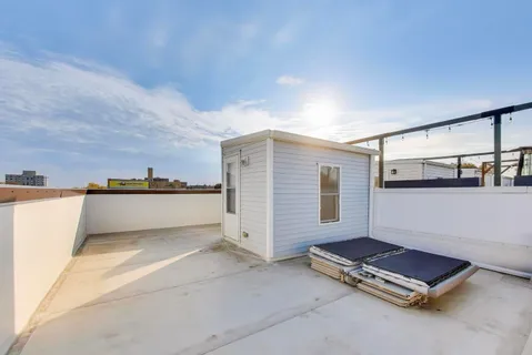 a view of a livingroom with furniture and staircase