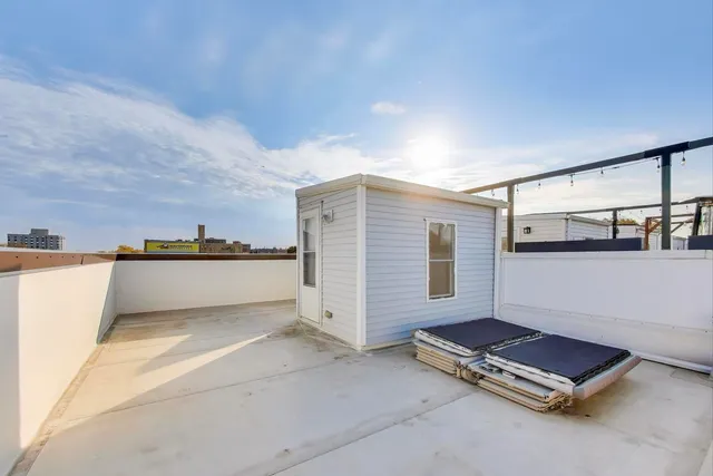 a view of a livingroom with furniture and staircase