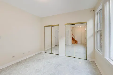 a front view of a building with retail shops